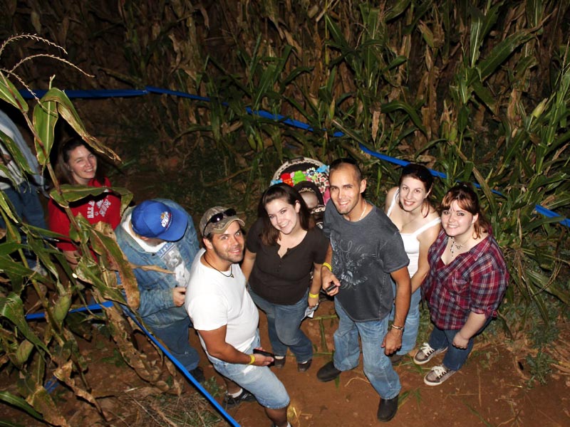 Friends in the corn maze at night